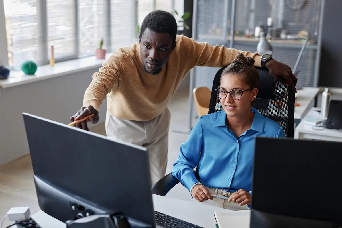 Professionasl working together on computer